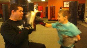 Ethan getting down to business with David at The Boxing Gym in Ballwin