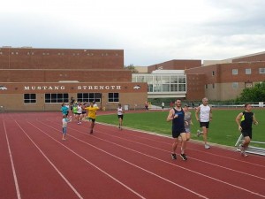 Look closely and you can see Silas spraying the runners as they go by